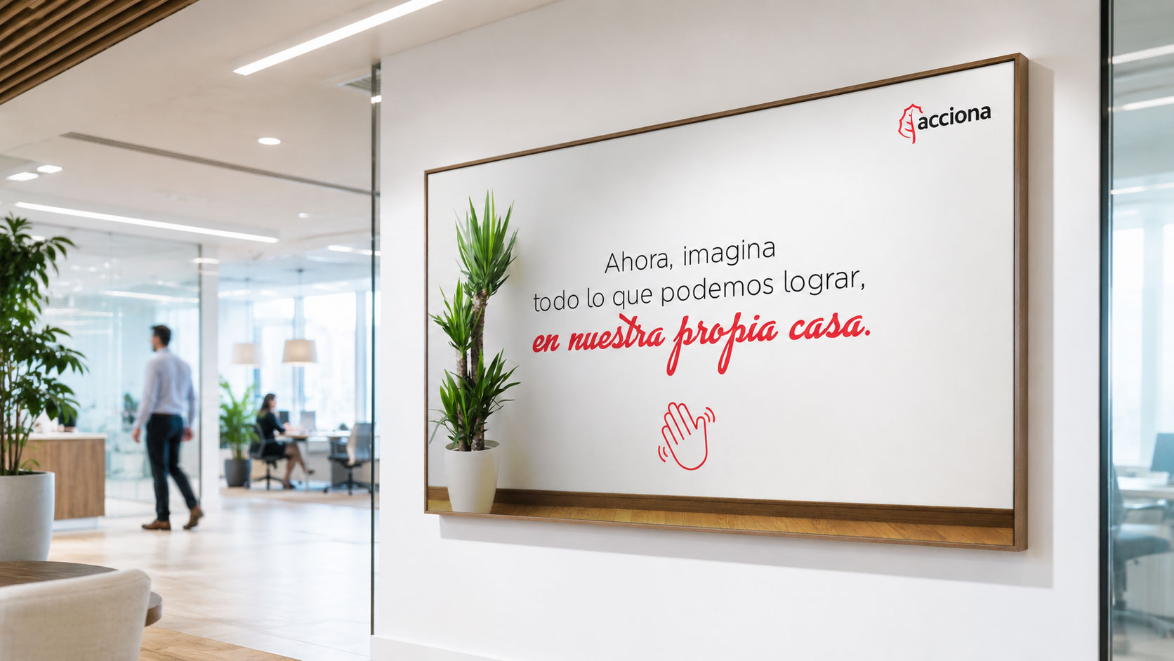 Muro de oficina con el mensaje "Ahora, imagina todo lo que podemos lograr, en nuestra propia casa."
