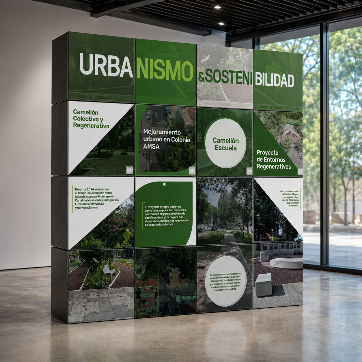 Estructura modular de cubos verdes con el mensaje "Urbanismo y Sostenibilidad" y proyectos urbanos